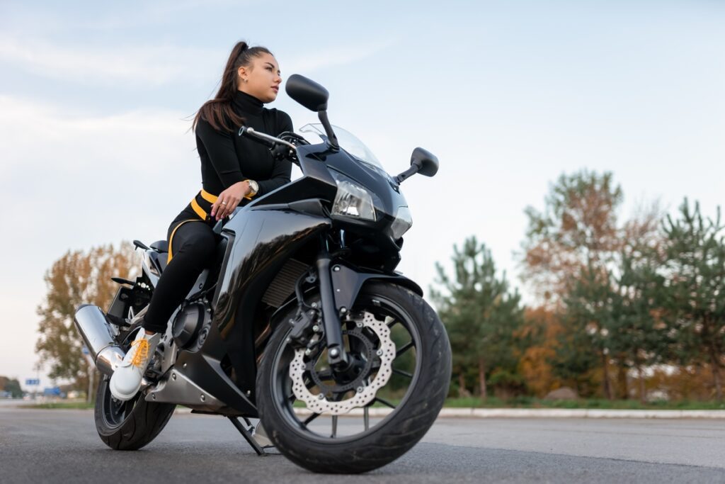 Stylish biker girl on motorcycle