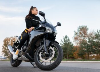 Stylish biker girl on motorcycle